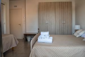 Postel nebo postele na pokoji v ubytování B&B Santa Filomena