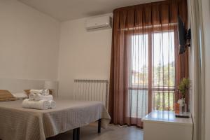 Postel nebo postele na pokoji v ubytování B&B Santa Filomena