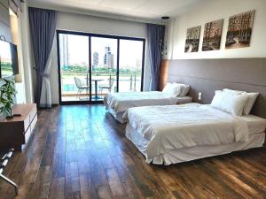 Ένα ή περισσότερα κρεβάτια σε δωμάτιο στο CHILCHILL Hotel Riverside