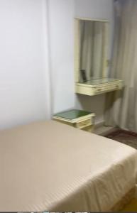 Postel nebo postele na pokoji v ubytování Gulf Tower + 1 fotografie