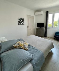 Postel nebo postele na pokoji v ubytování Magnifique appartement devant la plage