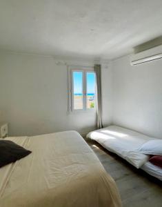Postel nebo postele na pokoji v ubytování Magnifique appartement devant la plage