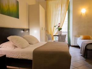 Posteľ alebo postele v izbe v ubytovaní Hotel Ligure