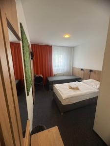 Posteľ alebo postele v izbe v ubytovaní Hotel Remy