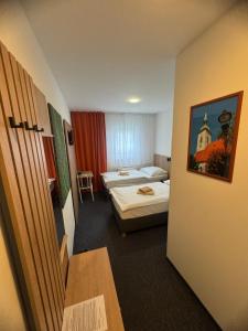 Posteľ alebo postele v izbe v ubytovaní Hotel Remy