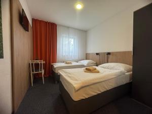 Posteľ alebo postele v izbe v ubytovaní Hotel Remy