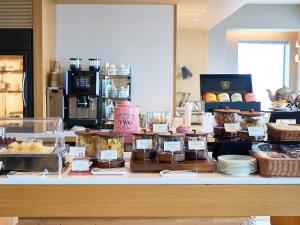 a bakery counter with many different types of pastries at Cerulean Tower Tokyu Hotel, A Pan Pacific Partner Hotel in Tokyo