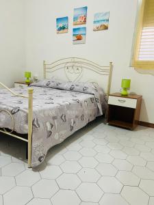 Postel nebo postele na pokoji v ubytování Casa Mariangela