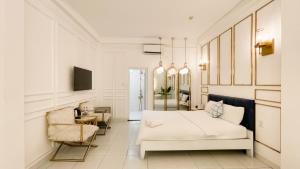 Postel nebo postele na pokoji v ubytování A In Hotel Glamour