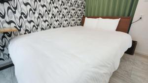Uma cama ou camas num quarto em CoCo SPACE