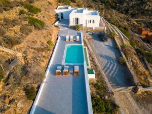 an aerial view of a house with a swimming pool at Sea and Sun l in Mylopotas