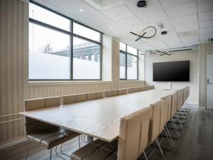 a large conference room with a large table and chairs at Quality Hotel Grand Kristiansund in Kristiansund