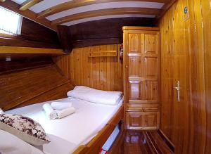 a small room with a bed in a boat at Your accommodation in Kotor bays in Kotor
