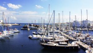 a bunch of boats are docked in a harbor at Marina Cap Monastir- Appart'Hôtel in Monastir