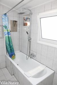a bathroom with a shower and a sink at Villa Nuray in Keramoti +50 photos