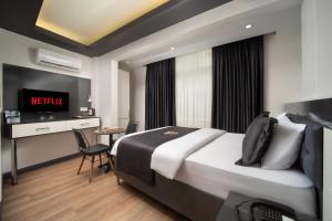 Postel nebo postele na pokoji v ubytování Bakırköy Zeugma Suit Otel