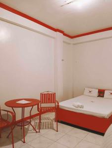 Ένα ή περισσότερα κρεβάτια σε δωμάτιο στο WJV INN BACOLOD