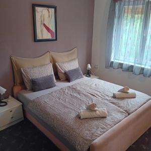 Postel nebo postele na pokoji v ubytování Apartman Joy + 7 fotografií