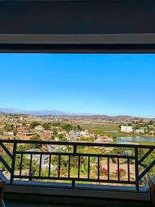 a view from the balcony of a house with a view at Villa Spacieuse et Confort in Antananarivo
