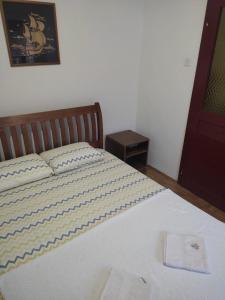 a large bed in a bedroom with at Uroš in Kamenari