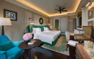 a bedroom with a bed and a living room at Hôtel de l'Amour Tam Đảo in Tam Ðảo +48 photos