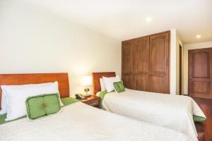 Postel nebo postele na pokoji v ubytování Hotel Portofino
