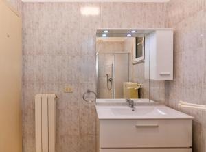 a bathroom with a sink and a mirror at Camping Europa in Marina di Massa +68 photos