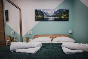 Postel nebo postele na pokoji v ubytování Gál Apartman Szeged -Keco-