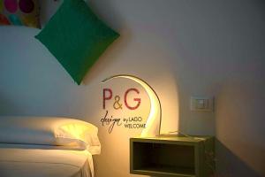 Postel nebo postele na pokoji v ubytování P&G design by Lago Welcome Enna