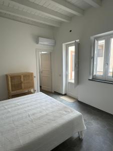 Postel nebo postele na pokoji v ubytování Appartamenti Sparanello