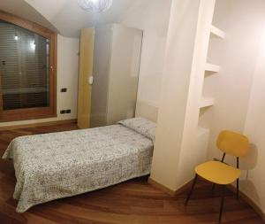 Postel nebo postele na pokoji v ubytování Mansarda in Villa Vescovado