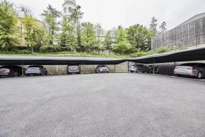 a large parking lot with cars parked in it at TJ Hotel in Seoul