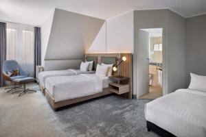 Postel nebo postele na pokoji v ubytování Courtyard by Marriott Schwerin + 37 fotografií