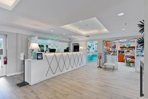 a store lobby with a counter and a chair at The Grand Caymanian Resort in George Town