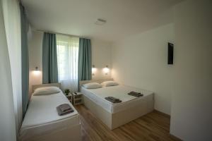 Postel nebo postele na pokoji v ubytování Milutinn-Kruška-Magnolija