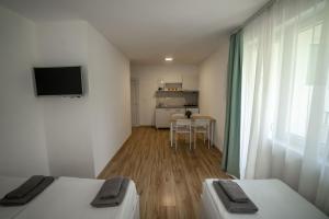 TV a/nebo společenská místnost v ubytování Milutinn-Kruška-Magnolija