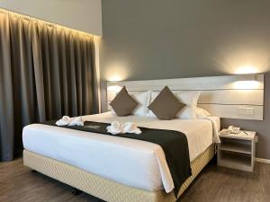 Postel nebo postele na pokoji v ubytování Hotel Arissa