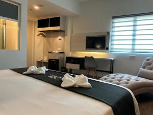 TV a/nebo společenská místnost v ubytování Hotel Arissa