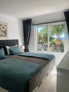 Posteľ alebo postele v izbe v ubytovaní Miraflores Jardin B 32, pool, wifi in Mijas Costa