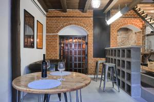 a room with a table with wine glasses on it at Ötköb Cottage - Wine House in Miskolc