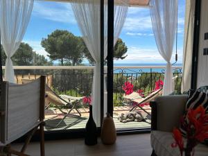 a living room with a view of the ocean at le lodge Saint Clair in Sète +54 photos