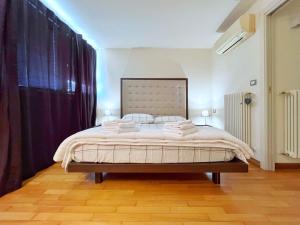 Ένα ή περισσότερα κρεβάτια σε δωμάτιο στο Casa Lido di Camaiore Eva&Gabri