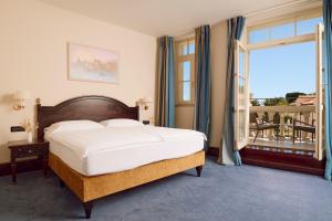 Кровать или кровати в номере Arbiana Heritage Hotel