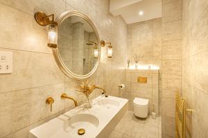a bathroom with a sink and a mirror at The Shell House - 5 mins to Cafes & Beaches in Bournemouth +68 photos