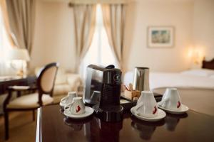 Кровать или кровати в номере Arbiana Heritage Hotel