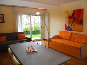 a living room with a couch and a table at ColleMare in Pesaro