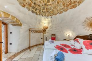 Giường trong phòng chung tại Il Papavero Rosso - Cozy Villa