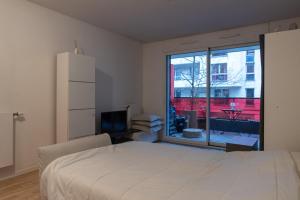 Säng eller sängar i ett rum på Studio 30m2 near Paris