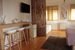 TV a/nebo společenská místnost v ubytování La Pietra Nera - Etna Home