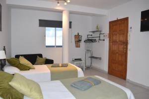 Postel nebo postele na pokoji v ubytování Apartamentos Sabare